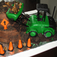 Articulated Front-End Loader Made for a little boy's 4th birthday. He's a big fan of construction equipment. Chocolate cake and buttercream, MMF, RK, Oreos...
