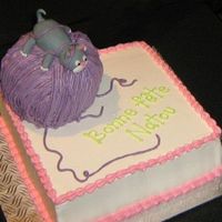 Cat Lover Inspired by Debbie Brown's design. Cat is in fondant, the rest (including the wool) is BC. The ball is cake. It was sculpted.