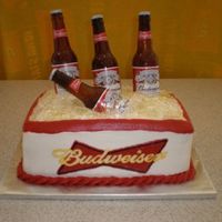 Budweiser Birthday Cake Sugar beer bottles and ice. Buttercream and frozen buttercream transfer. 3 layer neopolitan, everything edible except the caps and labels....