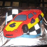 Race Car Birthday Cake This is a cake I made for my son's 6th birthday. I used a shaped cake pan, but the design did not imprint well so I made the design...