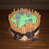 Graveyard Cake Triple Chocolate cake with dark chocolate ganache filling. Pirouette cookies for the 'fence', buttercream grass, gumpaste...