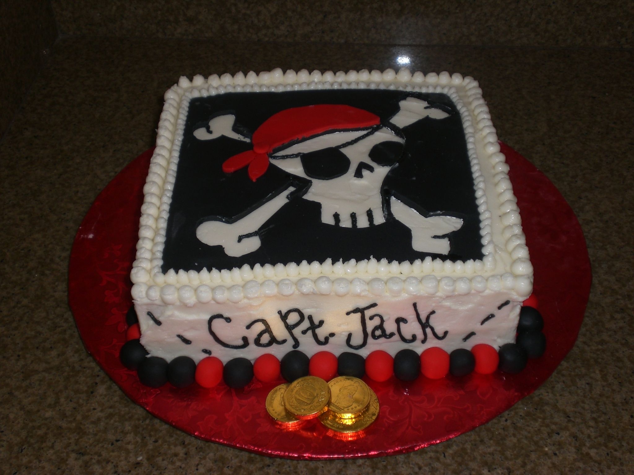 Pirate Cake Lemon cake w/ raspberry filling. Dec. cream cheese frosting. All black and red is fondant. Made for my son's 3rd birthday. Everyon...
