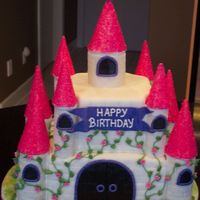 Castle Cake 8" and 6" square vanilla cakes (4' high) with banana flavoured Italian meringue buttercream; towers are made of gumpaste,...