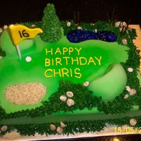 Golf Birthday Cake 9x13 WASC cake with praline flavoured Italian meringue buttercream, covered in fondant; water hazard is blue tinted piping gel and sandtrap...