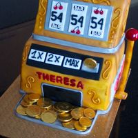 Theresa's Slot Machine Cake Made of one 9x13 and one 8" square vanilla cake, filled with IMBC and decorated with fondant.