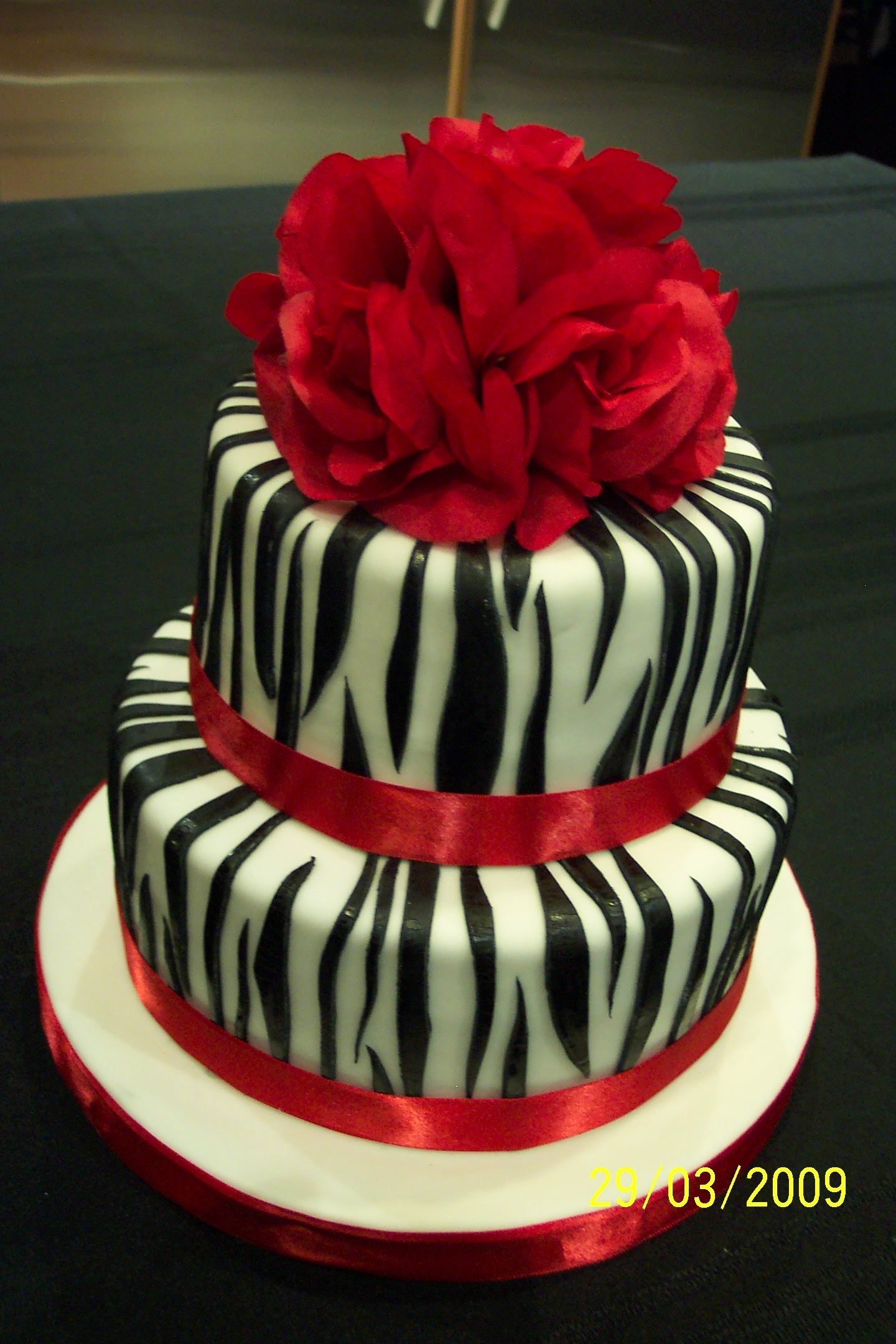 Zebra Stripes Birthday Cake 8" and 6" chocolate cakes with mocha flavoured IMBC; covered in fondant and decorated with fondant zebra stripes. Inspired by all...