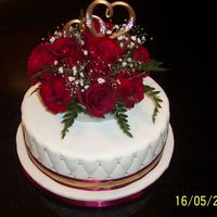 Golden Wedding Anniversary 10" lemon cake with three layers of lemon flavoured Italian meringue buttercream, covered in fondant and decorated with dragees and...