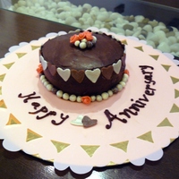 Anniversary Cake Chocolate cake with whipped cream filling and sugarpaste decorations. Inspired by cakes on this site, of course! TFL