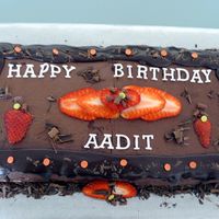 Chocolate & Strawberry Chocolate cake with whipped cream and strawberry filling, topped wtih choc buttercream drizzeled with choc ganche and decorated with...