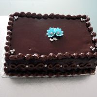 Anniversary For a friend's Anniversary. Mocha cake with choc ganache and mocha piping. Gumpaste accents. TFL