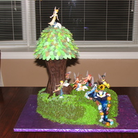 Tinkerbell & Friends Cake With Tree Disney Fairies cake, each with their specific flower. Buttercream grass, flowers vary from gumpaste-royal icing-cookie, tree trunk is rice...