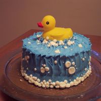 Rubber Ducky Bubble Cake This was a very simple cake for a friend's baby shower - just a layer cake, rubbyer ducky from the store, and bubbles all around!