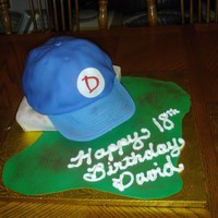 Baseball Cap Got this idea from a book I have for my son's birthday. A Base and ball cap, he loved it! Chocolate cake with fondant and gumpaste...