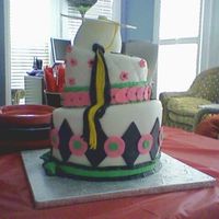 Girl's Grad Cake French Vanilla, pink lemonade filling, fondant icing and trim, cap from gumpaste, tassle from fondant
