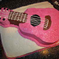 Pink Guitar Birthday Cake Wilton guitar pan cake on top of 11 x 17 layer cake.
