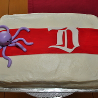 Detroit Red Wings Cake For my husband's birthday. Carrot cake with cream cheese BC. Vintage Detroit logo, stripe, and octopus all MMF. Red stripe was tinted...