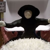 Welcome To My Side Of The Hill! The reaper looks a bit "off" because it fell apart. His sign says "Welcome to MY side of the Hill!" Half of the "...