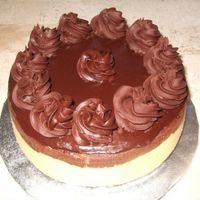 Black And White Cheesecake Chocolate graham crust, vanilla cheesecake, chocolate cheesecake, topped and decorated with chocolate ganache. This cheesecake raised $70...