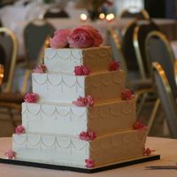 Square Cake With Buttercream And Flowers Simple square wedding cake with buttercream and real flowers.