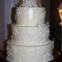 Snowflake Cake Swiss Meringue with royal icing snowflakes dusted with luster dust