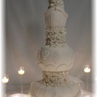 Unique Victorian Style Fake Wedding Cake This cake is made from special designed styrofoam forms, covered with gumpaste, gumpaste swags, hundreds of hand rolled gumpaste roses,...