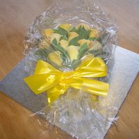 Thank You Ribbon Roses on a Maderia Cake which is covered with Sugarpaste