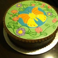 Butterfly Cake Butterfly in royal icing (i traced a stained glass template)Double chocolate butter cream icing to coat cake, shell borders