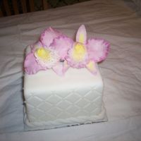 Gumpaste Orchids These were my first gumpaste orchids. Cake is fondant with diamond impression mat