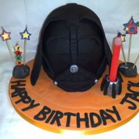 Darth Vader Cake i took inspiration for this cake from bakingirl. darth is a sponge cake with jam and buttercream filling. his light saber is a glow stick...