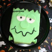 Frankenstein Fun Decorated and accented with fondant made this spooky character cute. :)