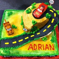 A Car's Birthday I sculpted this cake into a slope and made a plateau with a 6" round cake.
