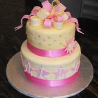 Pink And Yellow Surprise 6" and 8" covered in MMF, gumpaste ribbon, letters and stars.Pink, Yellow and Orange