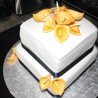 Fall Wedding 10" and 8 " Chocolate filled with vanilla BC. First time doing Calla Lillies ~ dusted w/ Orange petal dusts