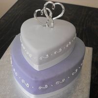 Stacked Hearts 12" and 8" lemon cake with lemon curd filling and swiss meringue buttercream icing. Done in MMF.