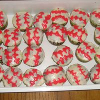 Baseball Cupcakes Made these for my brother's team gathering. Yes, the red spread, but 11 year olds don't care. :)