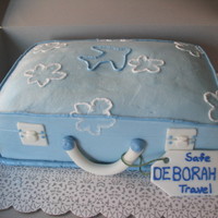 Suitcase Cake This was for a woman at my husband's office who was going on her sabatacle. It's covered in bc with fondant accents