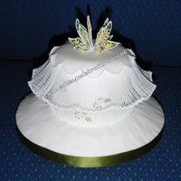 Floating Extension Work This was the display piece I created for the ICES Convention 2010 San DiegoFondant covered cake, all work royal icingThe extension work is...