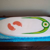 Surfboard I made this for my bro in law who loves to surf. It was a vanilla cake covered in fandant, with gumpaste waves on the side. This cake was 3...