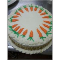 Carrot Cake cream cheese frosting and yummy nuts around the sides.