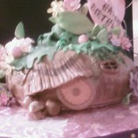 Tinkerbells House In Disneys Pixie Hollow Chocolate puzzle cake with milk chocolate, dark chocolate, and white chocolate french buttercream.