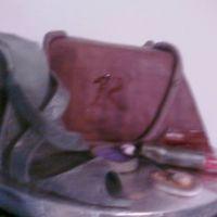 Stiletto And Purse Cake Pinnaple rum cake with French buttercream and marshmallow fondant. The stiletto and makeup are gumpaste. I had a blast making this.