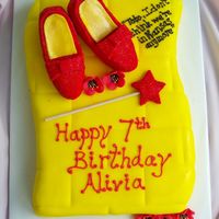 Ruby Red Slippers This is an 11x15 cake cut into the shape of the yellow brick road and covered with MMF. The shoes are cake! They are covered with...