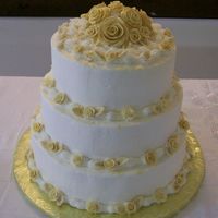 50Th Wedding Anniversary This is a three tiered 50th wedding anniversary cake. (10", 12", and 14") It is covered with buttercream icing and decorated...