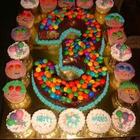 Harris Moist chocolate cake surrounded by vaniila butter and chocolate cupcakes