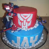 Transformer Cake This was my little boy's 6th birthday cake. 2 tier (10'' & 8") All buttercream except the autobot face, letters,...