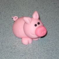 Pig This is my first time making fondant and the first time making a figure. I am really proud of it. I look at it I can't believe it was...