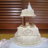 Seashell Wedding Cake Ivory fondant wedding cake - cake flavors were marble, chocolate and french vanilla, with buttercream and raspberry filling.