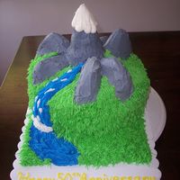 Mountain Themed Cake This is a mountain themed cake that I did for a friend. Marble cake, with vanilla BC.