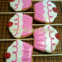Pinkalicious Cookie Pops! NFSC with royal icing. Cherry covered in red disco dust! Disco dust is my new fav! These were to accompany a Pinkalicious cake and were...