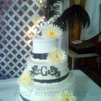 Monogram Daisy 14" 10" 6" rounds. Wedding cake with Dreamsicle icing. It was so scrumptious! Flowers are fake.